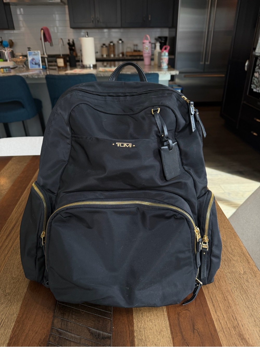 Tumi Black Backpack with Gold Zippers